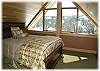 Upstairs bedroom with a queen size bed