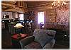 The living area is open to the dining room