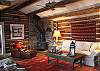 Another view of the cozy living room and fireplace