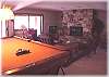 A pool table and fireplace for gatherings
