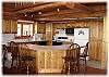 A complete kitchen with bar seating