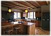 A gourmet kitchen with extra seating at the island counter