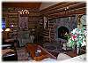 A beautiful rock fireplace is the focal point of the living area