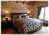 The second master bedroom with king size bed, the best linens and private bath