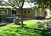 Great back lawn area with a picnic table