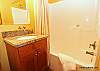 The lower level bathroom with a tub/shower combo