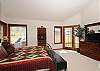 Master bedroom with patio doors and private bath