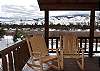 Sit on the private covered deck in your own log rocking chairs