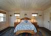 The master bedroom is shared with the dining area
