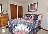 Upstairs bedroom with a queen size bed