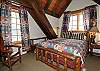 The master bedroom with a queen