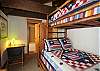The second bedroom upstairs with bunk beds and private bath