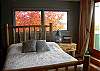 Bedroom with direct access to the deck overlooking the pond