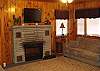 This room has a sofa, and 2 futons with an electric fireplace.