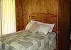 1 Queen Bed.  This room also has a full bath, couch, chair, TV and an electric fireplace.