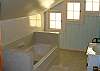 This bath does not have a shower.  Downstairs bath does.