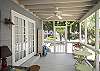 The screened porch has lots of outdoor seating including a table for 4-6.