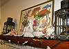 All over the cottage you will find local art and color!  This is the mantel in den/family room.