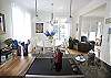 The "open concept" allows the cook to have visibility throughout the 3 main living areas.  This is the kitchen island looking towards the dining room and the living room is to the right.