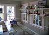 The Sun room is right beside the kitchen and has a great "dining room" table- a vintage picnic table.