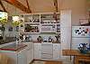 The kitchen is an open kitchen with beautiful open shelves and wooden counter tops.  The home is also stocked with our Mermaid Cottage coffee service as well as spices to cook with.