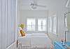 The queen bed headboard is a piece of vintage iron fencing.