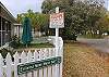 We are located on a corner lot, directly behind the magnificent Officier's Row Houses. The Tybee Island Lighthouse is less then 5 minutes away. Our handpainted sign saws it all- "Slow down, you aren't on the Mainland!"