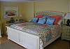 The King Size bed in the Garden Room which is one of two master suites. Each master suite features a flat screen TV and full master bathroom. The bed features 100% cotton sheets and lots of pillows to relax and enjoy.