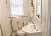 The bathroom includes a shower/tub combination and the orginal black and white subway tile from the 1930's. We also have an outside private shower with hot and cold water.