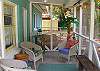 The screened porch is ideal to relax and read.