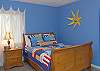 Bedroom 3 features orginal art from regional artists and a queen size bed