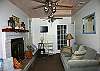 Through that door - the second bathroom with large shower with rain water heads -our guests love - also full sized energy-efficient washer and dryer - then out to the large back screened porch!  To the right passed the lamp is the third bedroom with Queen bed and an extra twin bed.