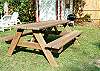 Our backyard picnic table. Ideal to enjoy eating outside! Please notice our Charcoal Grill as well. Our shed is filled with beach chairs, beach cart, beach umbrella and croquet and bocce ball games for your enjoyment!
