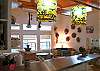 The great room is a combination of the open kitchen, family sitting room with TV and seating.  The ceiling soars with open space and beautiful wood beams. Natural light with the many windows everywhere.