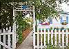 Cottage charm with window boxes, native plants and shutters.  Just how a cottage is supposed to look on Tybee Island!
