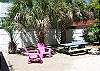 The back yard of Good Times is your private fully fenced back yard. There is an outdoor shower, grill, seating, picnic table  and even a dog house for your furry babies.