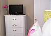 This is in the master bedroom.  A bedroom perfect  flat screen with cable for you to enjoy - all of our cottages have free wi-fi!