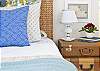 The 2nd bedroom has two twin beds and a half bathroom. Lots of natural light and hardwood floors that is throughout the entire home.