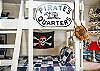Downstairs bedroom #2.  Bunk beds on bottom; top of beds are for play; not a sleeping area.  Perfect pirate decor!