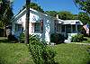 The cottage sits on a corner lot and has plenty of off street parking on the side and front of the cottage.  The back yard is fenced in and great for kids and dogs to play.