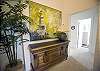 This area is on the 2nd floor at the top of the stairs from the living room.  Furnishings are from the Paula Deen collection, and the fabulous artwork is by a local artist.