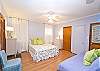 Another view of the queen bed and twin bed.