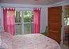 Bedroom 1 features a queen size bed.