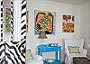 The living room is in the front of the cottage. Cable TV, orginal art and washable white slip covers on all the furniture.  Of yes, and those zebra touches everywhere!