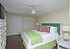 This is the other bedroom on the first floor. This bedroom has a king bed with cable TV.  The headboard is an old vintage shutter painted a GREAT green!