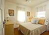 The cottage has two bedrooms- this is the double bedroom. Bright, cheerful and very very relaxing. The art is vintage pictures we found in some local "treasure " stores!