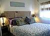 In typical Tybee "reuse and restore" fashion - an original door from this cottage has been turned into the headboard!