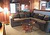 The living room features a very large and comfy sofa!