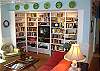 The book shelves are filled with hundreds of books, games and puzzles for all ages and large TV/ DVD.  The entire home features hardwood floors.