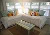 This area is not an actual bedroom, but a bedroom area with drapes that shut to make this a private area. Features 2 twin beds.